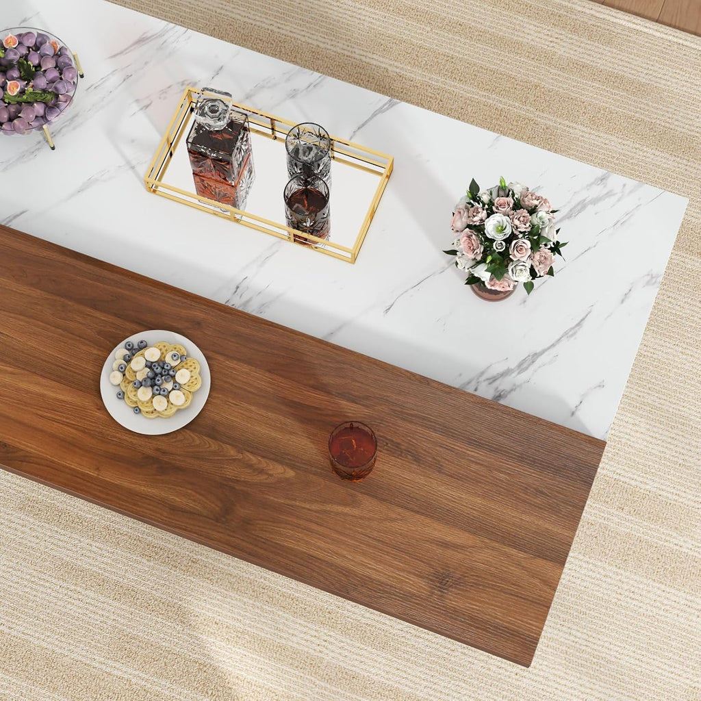 Close view of the white faux marble and wood-look tabletop